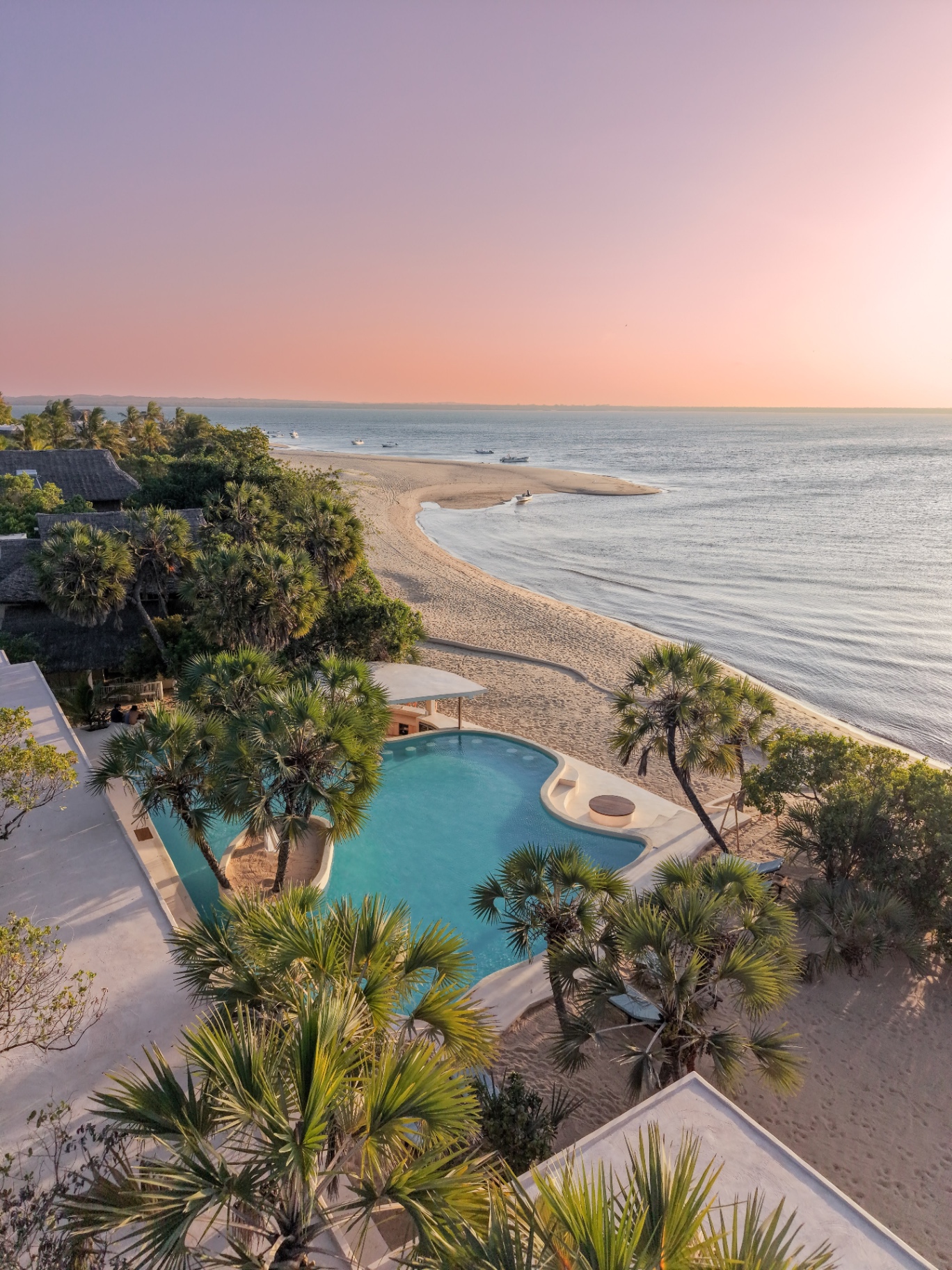Aerial view of beachfront pool at sunset